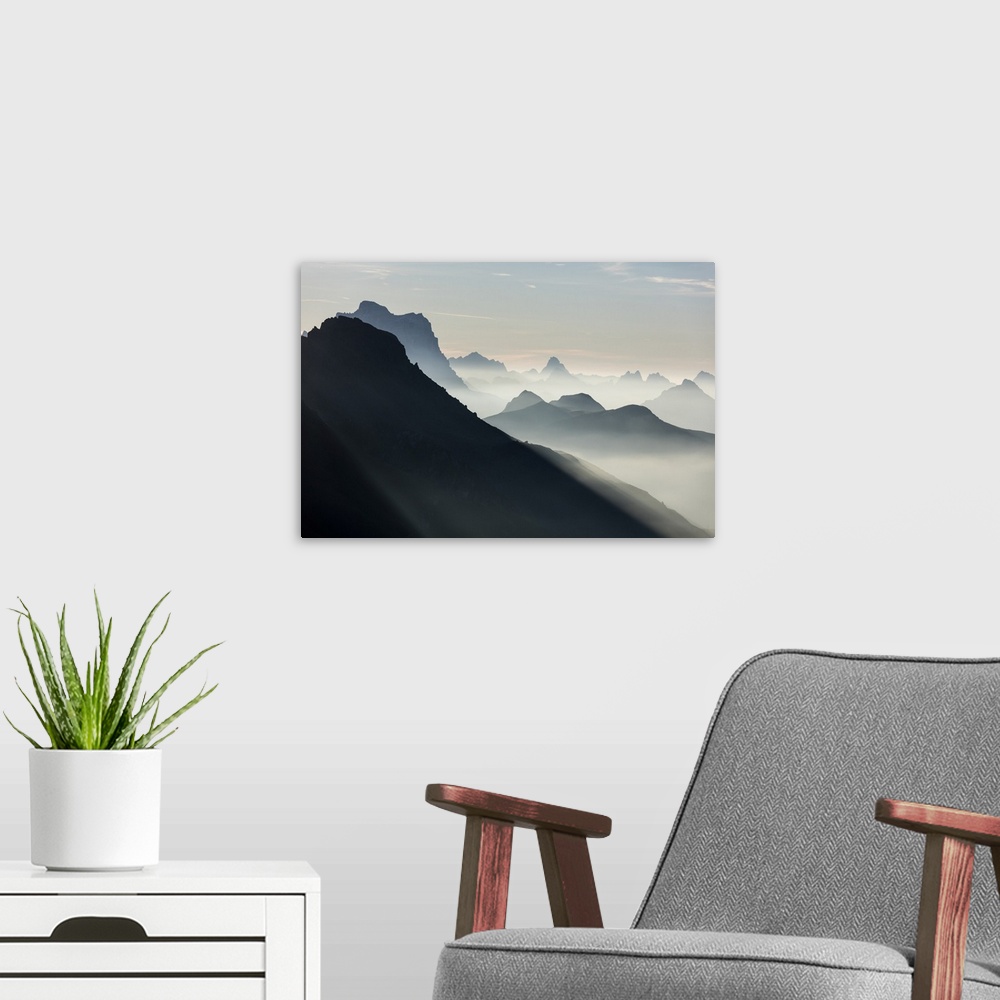 A modern room featuring Mist on peaks of Dolomites and Monte Pelmo seen from Cima Belvedere at dawn, Val di Fassa, Trenti...
