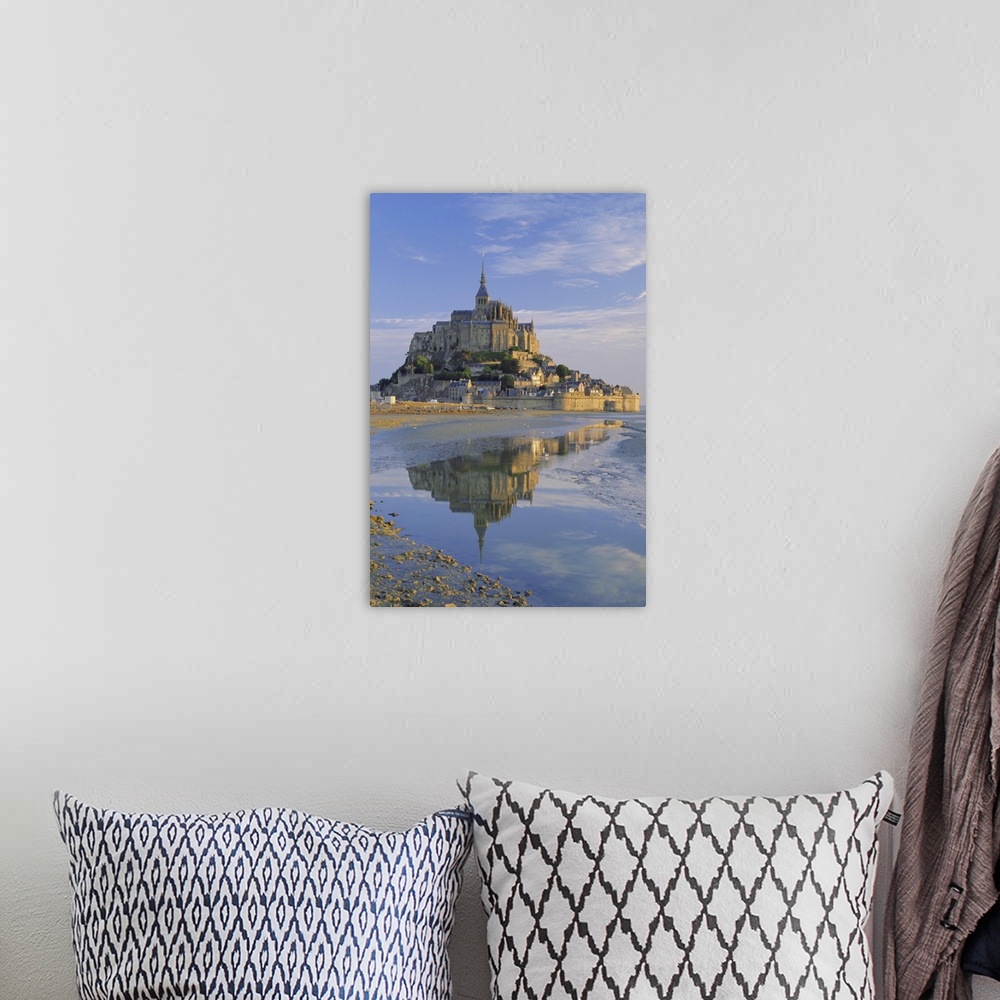A bohemian room featuring Mont St. Michel (Mont Saint-Michel) reflected in water, Manche, Normandy, France