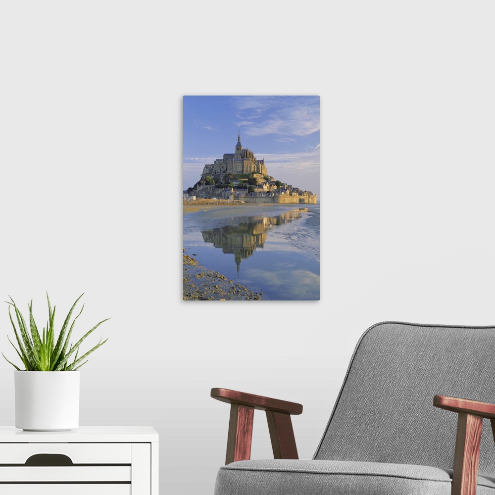 A modern room featuring Mont St. Michel (Mont Saint-Michel) reflected in water, Manche, Normandy, France