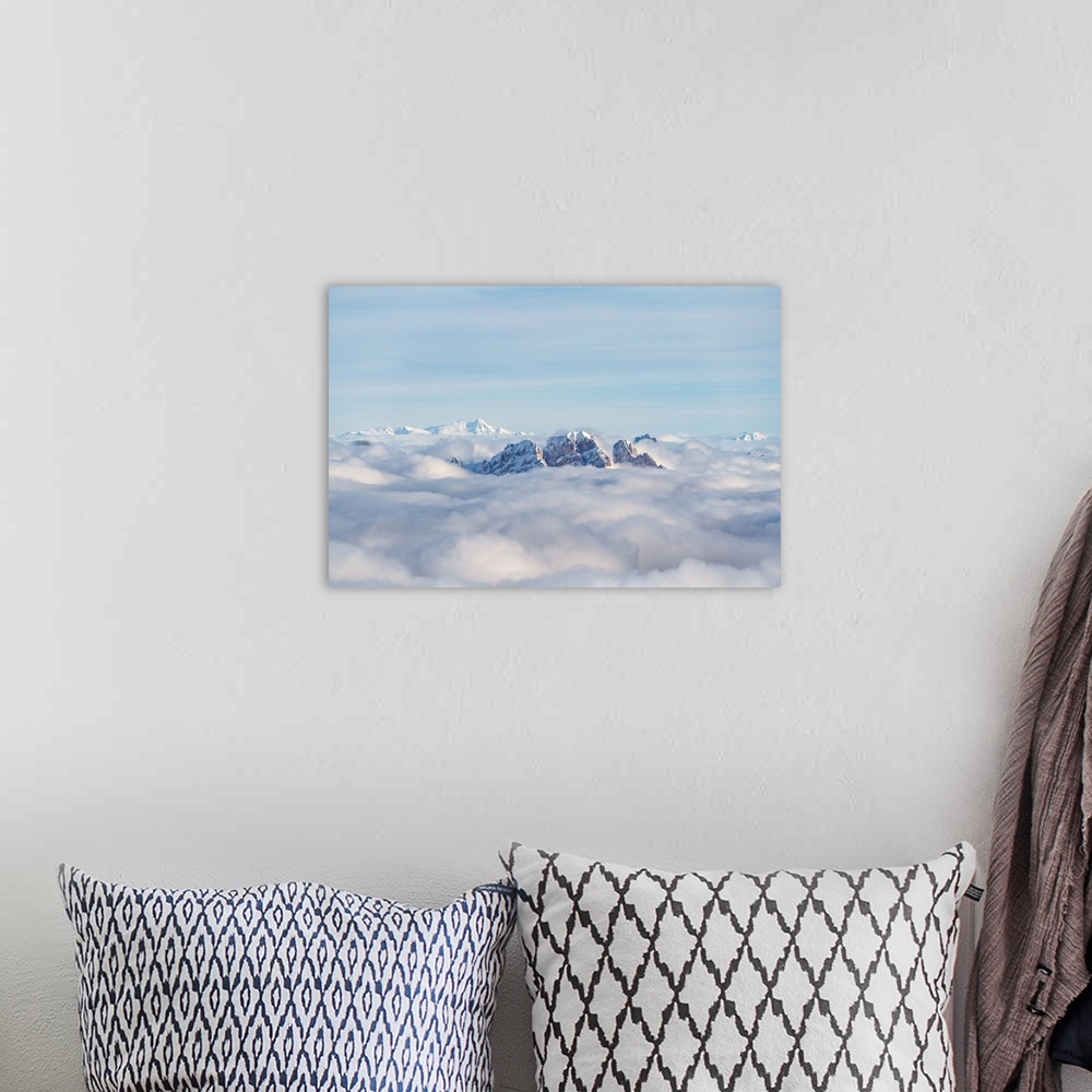 A bohemian room featuring Aerial view of Monte Cristallo and Pomagagnon peaks emerging from clouds, Dolomites, Belluno prov...