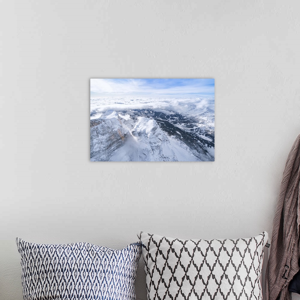 A bohemian room featuring Monte Pelmo surrounded by a sea of clouds in winter, aerial view, Dolomites, Belluno province, Ve...