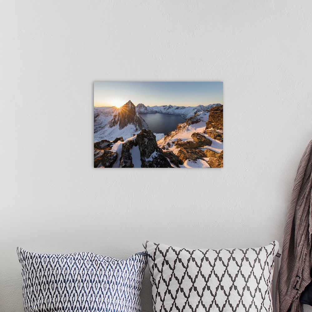 A bohemian room featuring First light of sunrise on Mount Segla and Mefjorden framed by the frozen sea seen from peak Heste...