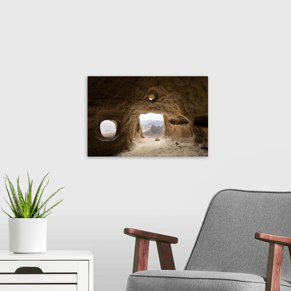 A modern room featuring Natural windows inside cave at the entrance of Daniel Korkor rock-hewn church, Gheralta Mountains...