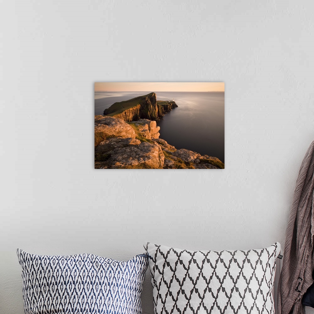 A bohemian room featuring Neist Point and Lighthouse bathed in evening light, Isle of Skye, Highland, Scotland