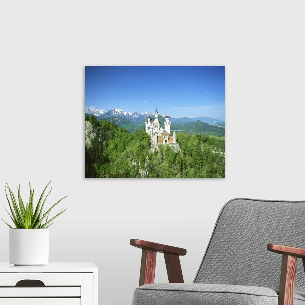A modern room featuring Neuschwanstein Castle on wooded hill, Bavaria, Germany