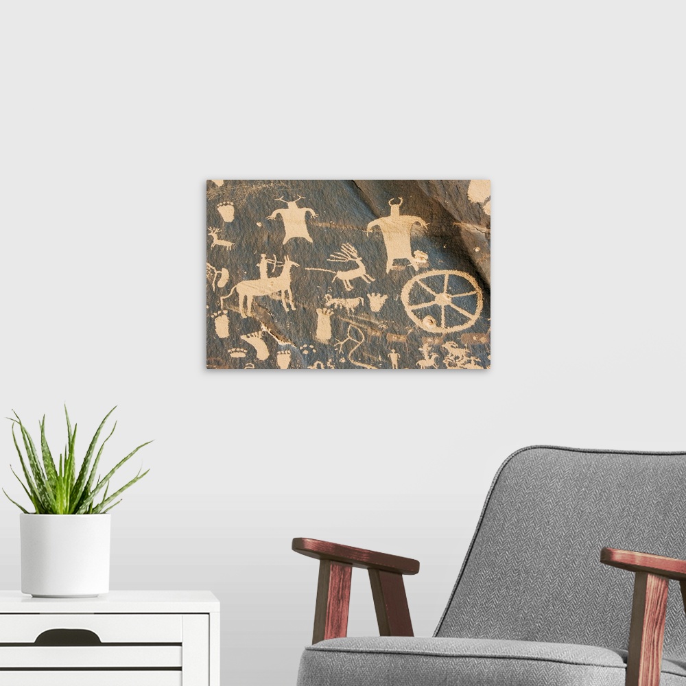 A modern room featuring Newspaper Rock, petroglyph panel etched in sandstone, Utah