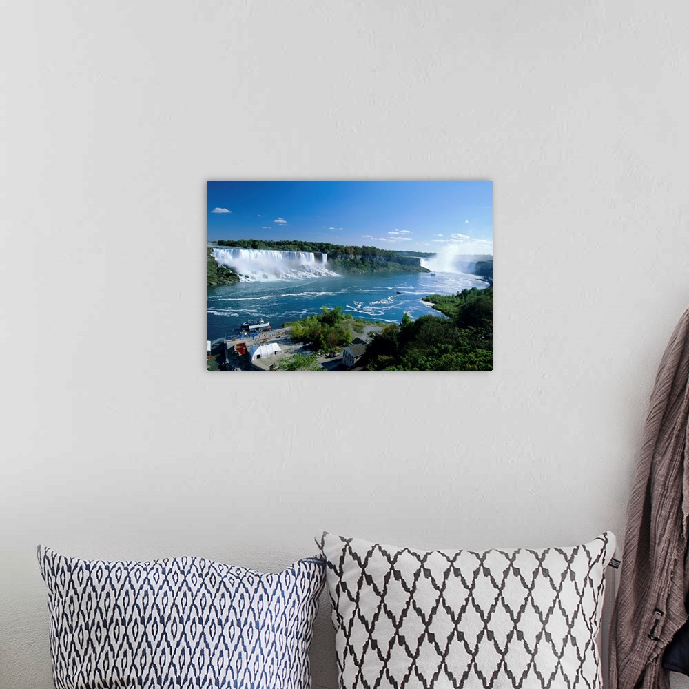 A bohemian room featuring Niagara Falls on the Niagara River that connects Lakes Ontario and Erie, American Falls on the le...