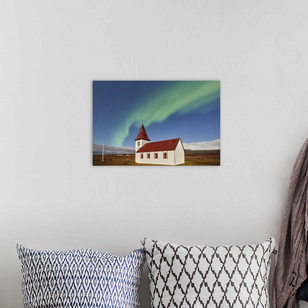 A bohemian room featuring Night sky and Northern Lights (Aurora Borealis) over the church in the village of Hellnar, in Sna...
