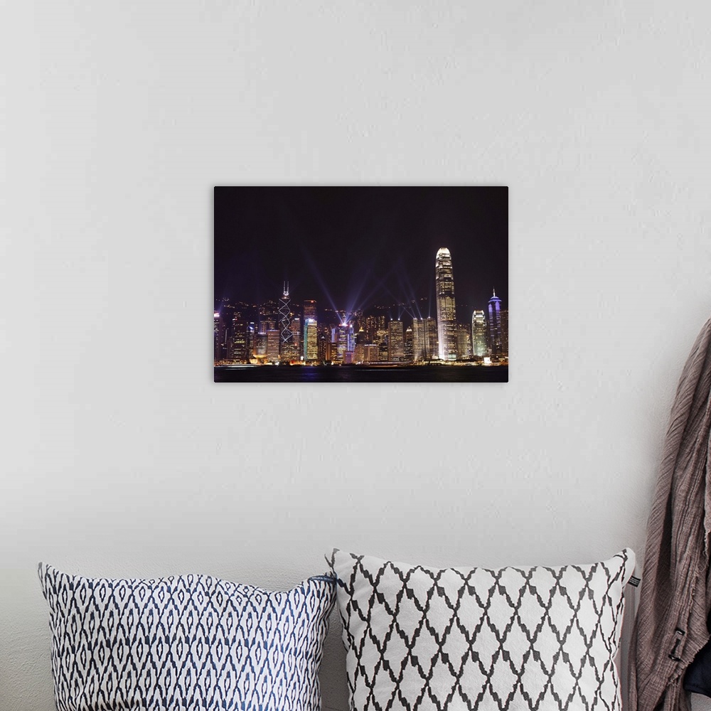 A bohemian room featuring Nightly sound and light show over Hong Kong Island skyline, Hong Kong, China, Asia