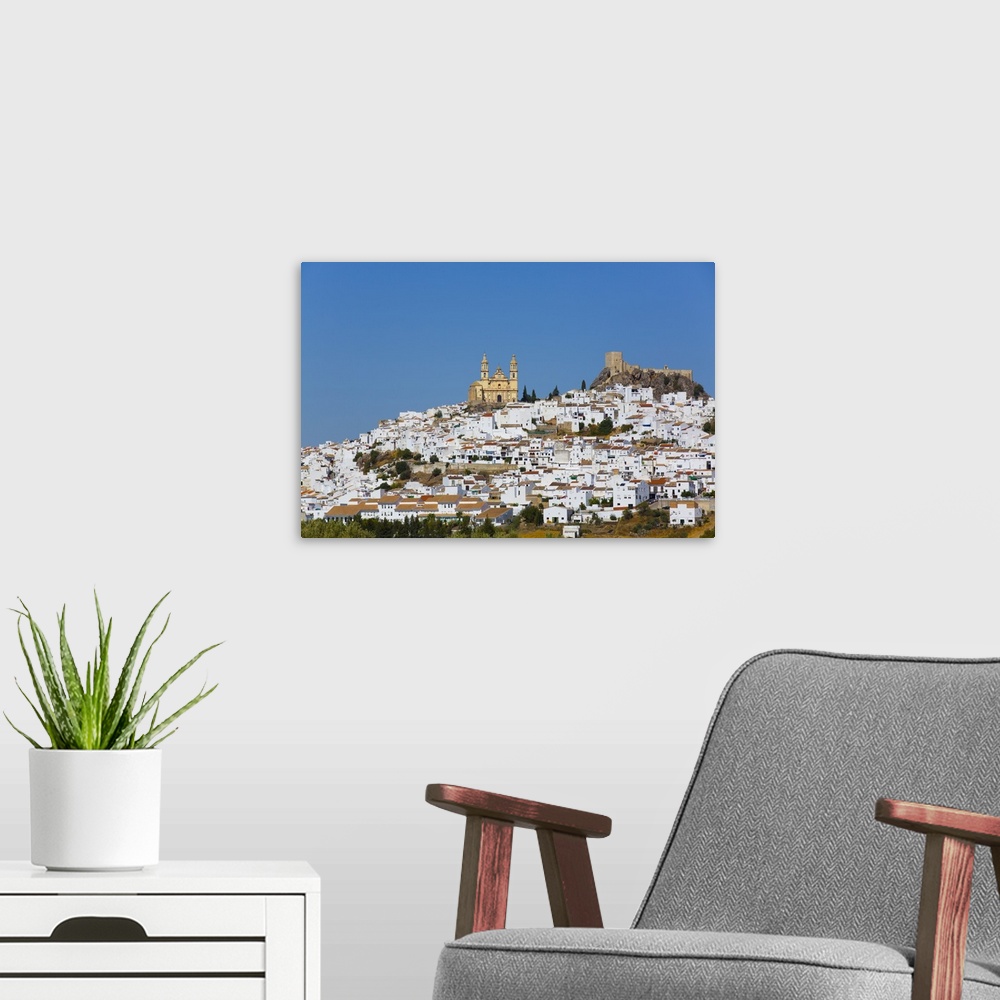 A modern room featuring Nuestra Senora de la Encarnacion Church on the left and Arab Castle on the right, Olvera, Andaluc...