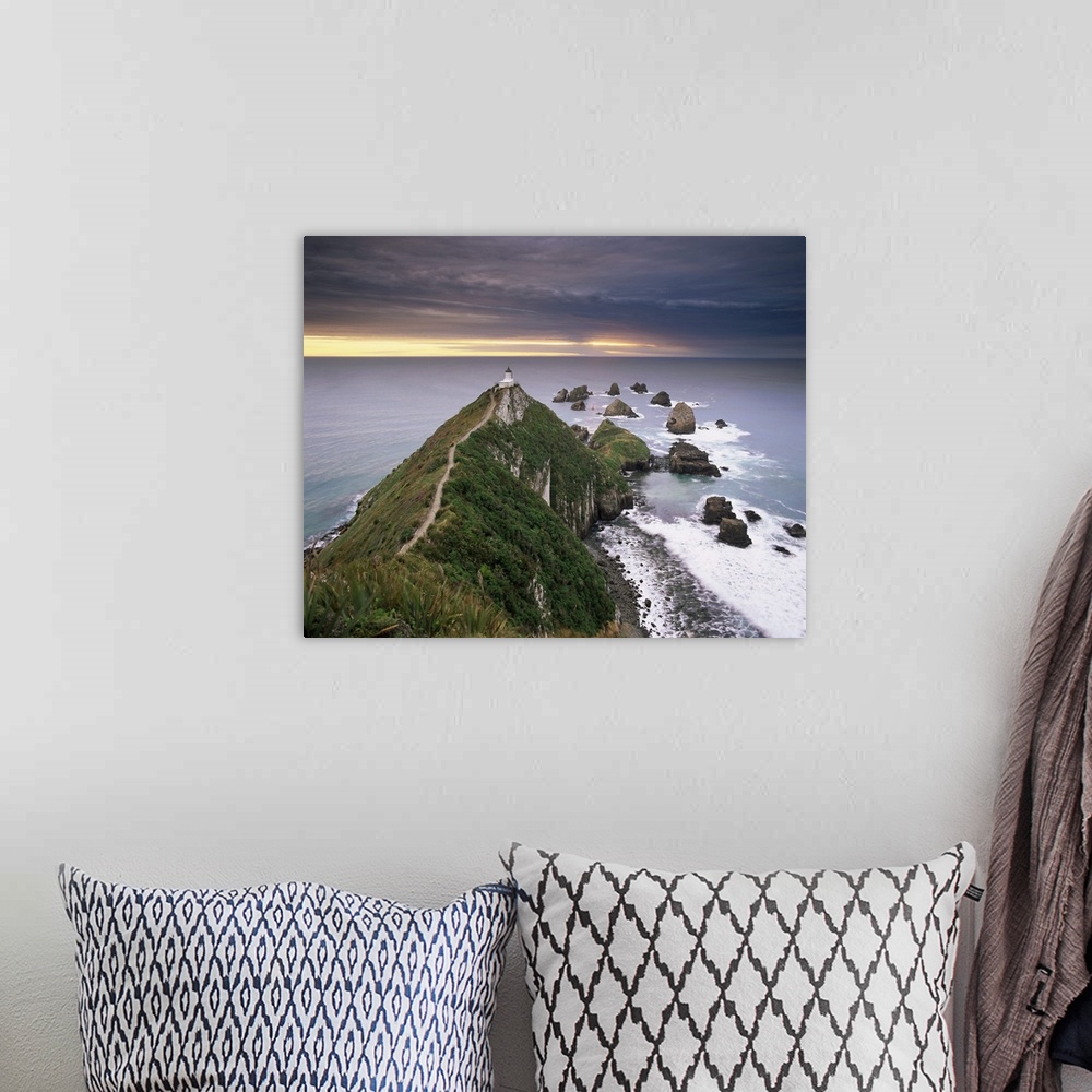 A bohemian room featuring Nugget Point lighthouse on the coast and overcast sky, the Catlins, New Zealand