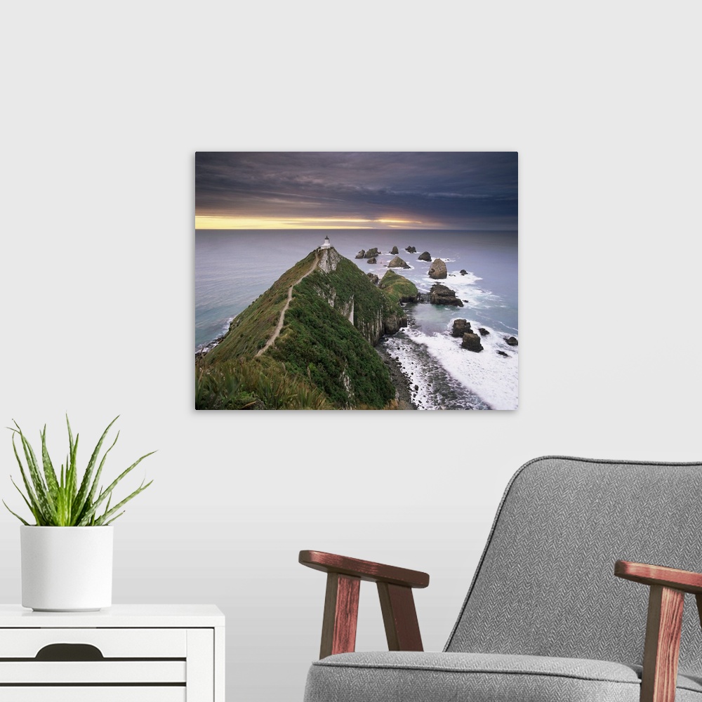 A modern room featuring Nugget Point lighthouse on the coast and overcast sky, the Catlins, New Zealand