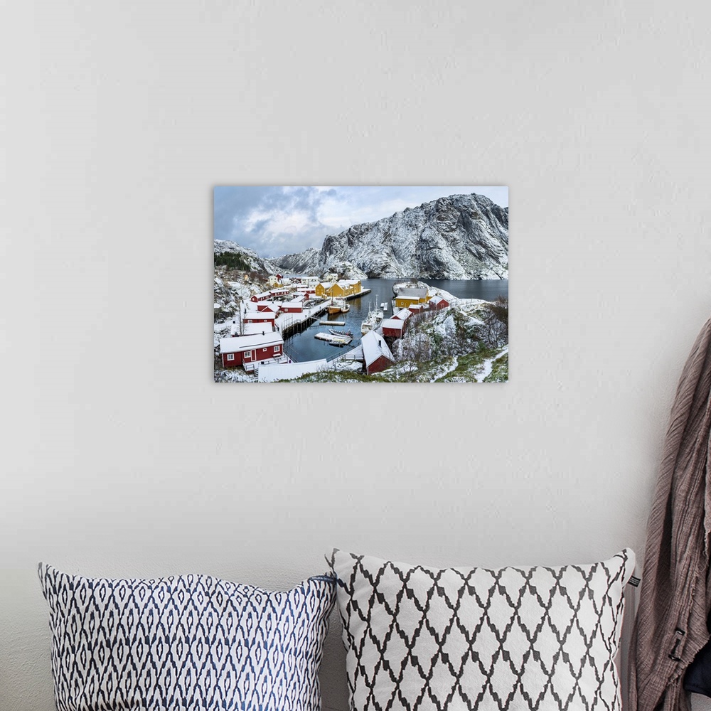 A bohemian room featuring Panoramic of the fishing village of Nusfjord and harbor covered with snow in winter, Nordland, Lo...