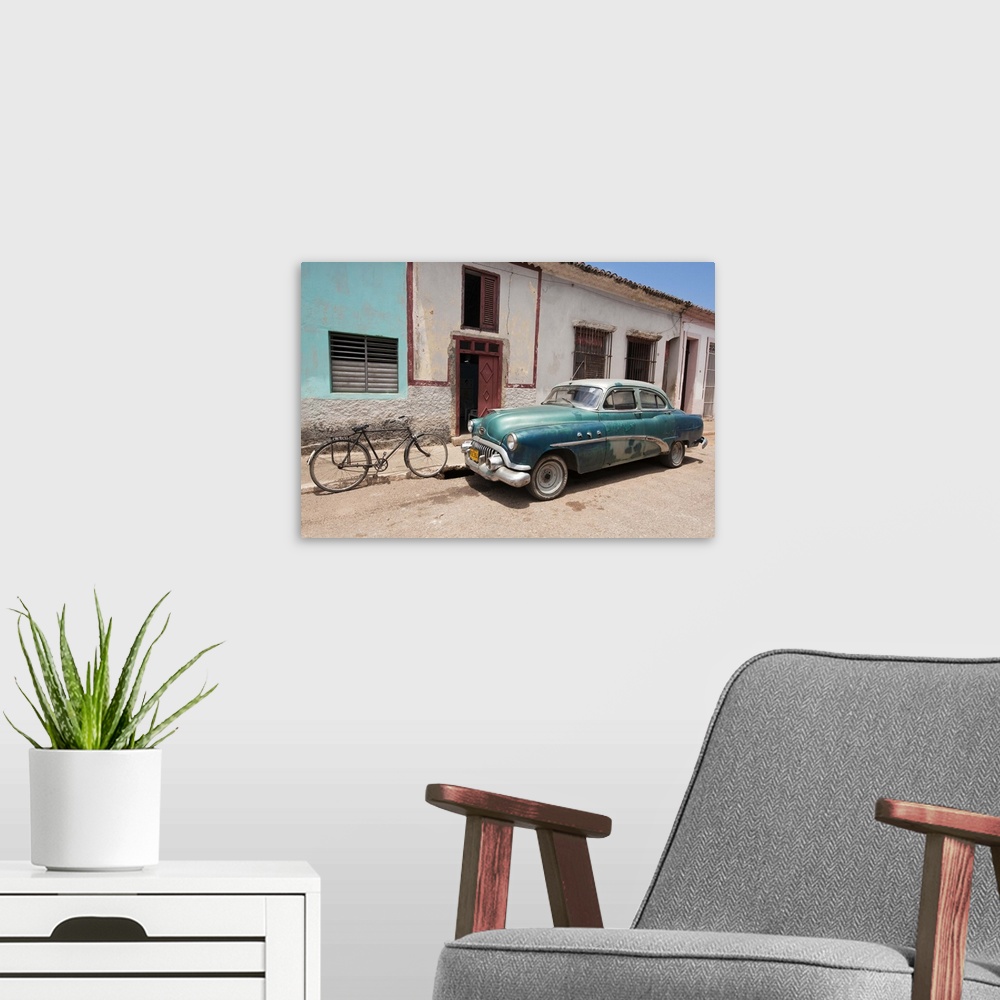 A modern room featuring Old 1950s car, Remedios, Cuba, West Indies, Central America