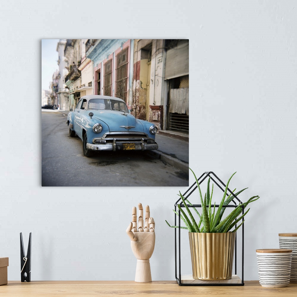 A bohemian room featuring Old blue American car, Cienfugeos, Cuba, West Indies, Central America