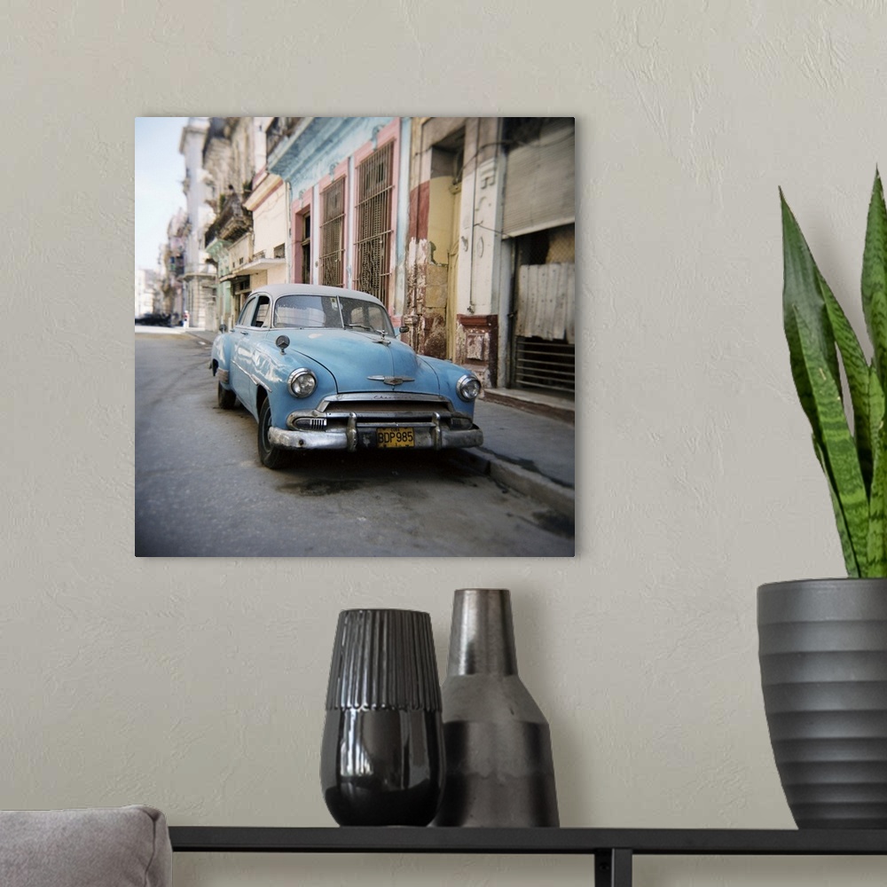 A modern room featuring Old blue American car, Cienfugeos, Cuba, West Indies, Central America
