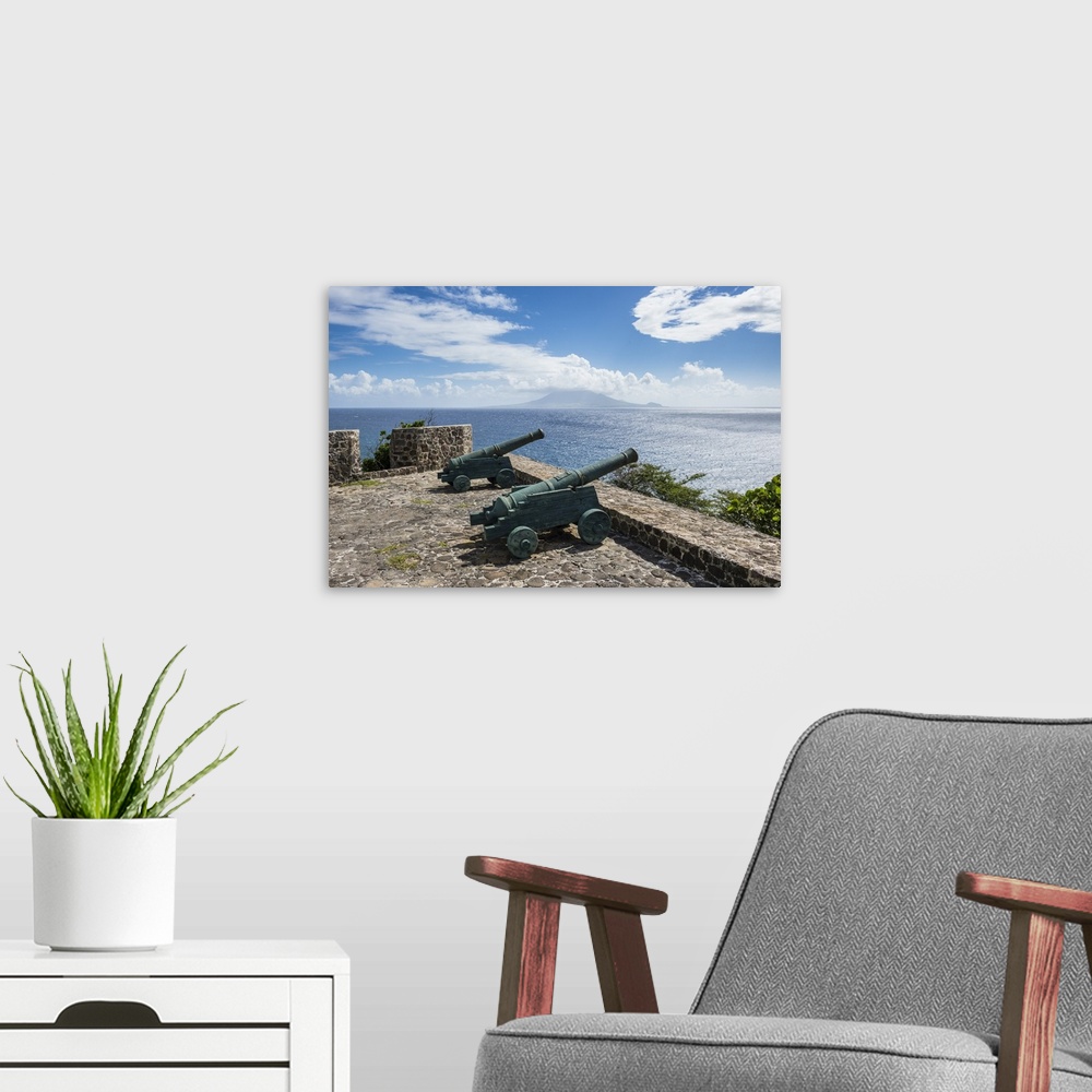 A modern room featuring Old cannons on the southern coastline of St. Eustatius, Statia, Netherland Antilles, West Indies,...