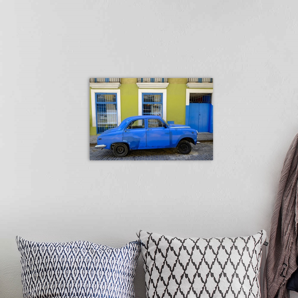 A bohemian room featuring Old car parked in front of a colorful building, Old Havana, Cuba, West Indies, Central America