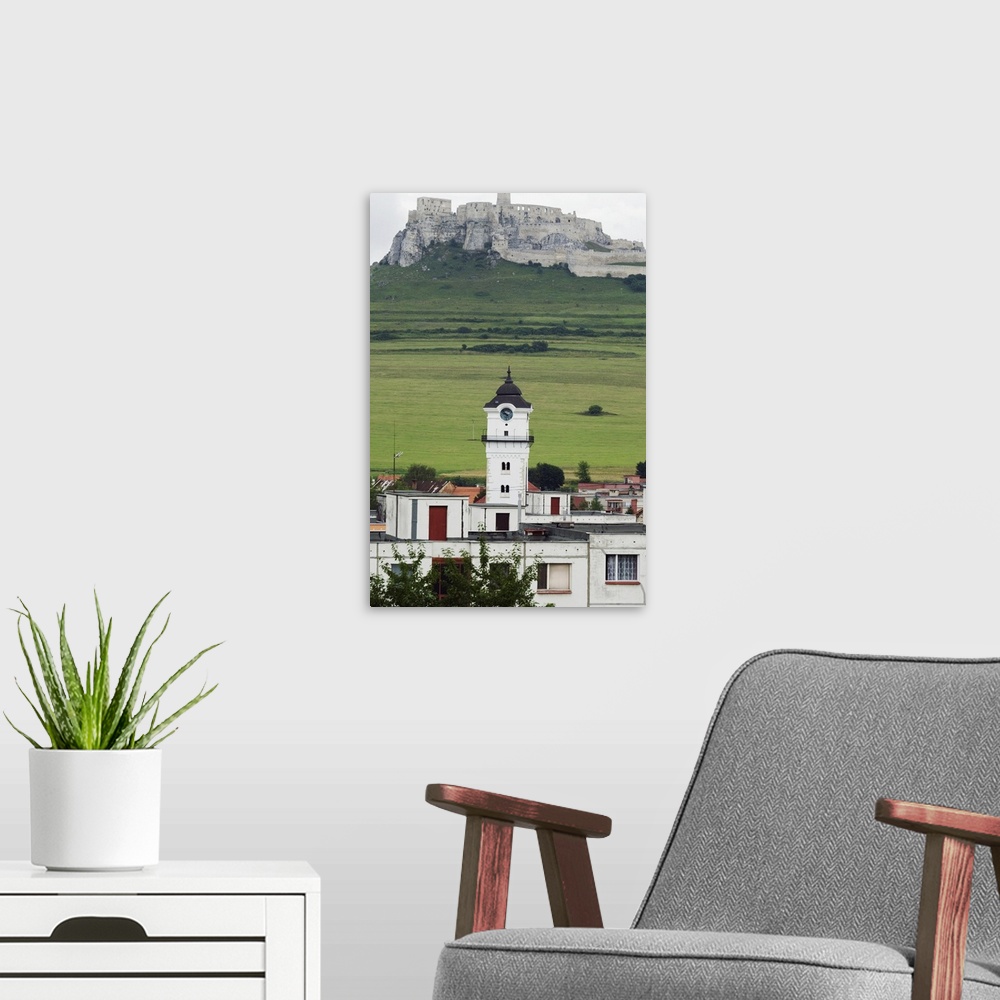 A modern room featuring Old Town clock tower and ruins of Spissky Castle, Spisske Podhradie, Slovakia
