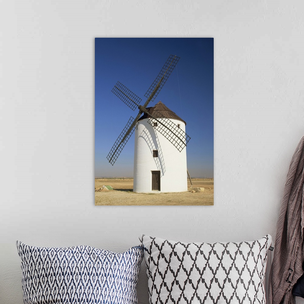A bohemian room featuring One of the windmills above the village of Consuegra, Castile la Mancha, Spain