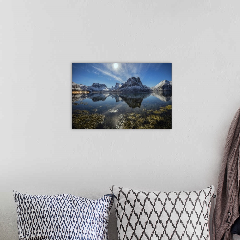 A bohemian room featuring Panorama of snowy peaks reflected in sea in a cold starry night, Bergsbotn, Senja, Troms County, ...