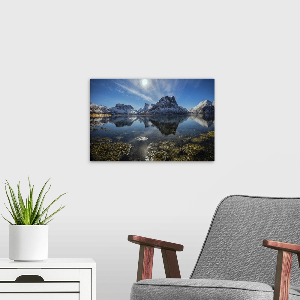 A modern room featuring Panorama of snowy peaks reflected in sea in a cold starry night, Bergsbotn, Senja, Troms County, ...