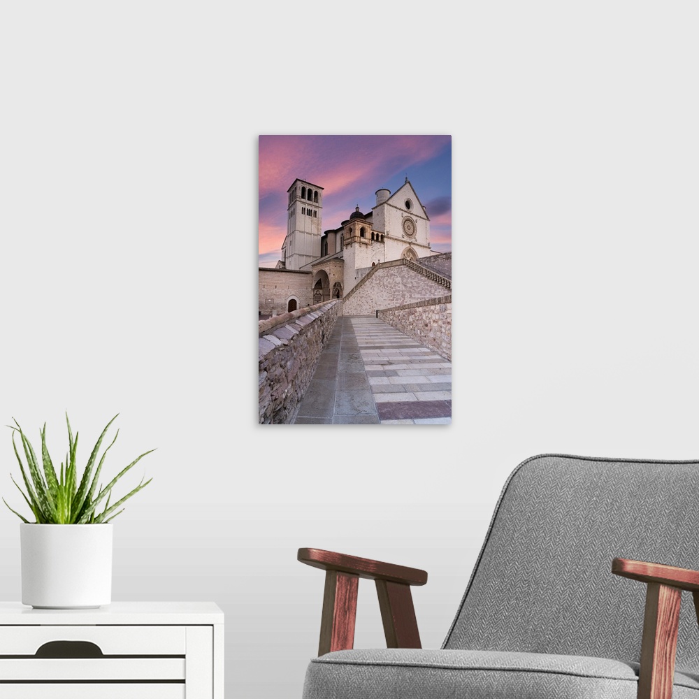A modern room featuring Pink sunrise over the Papal Basilica of Saint Francis in Assisi, UNESCO World Heritage Site, Peru...