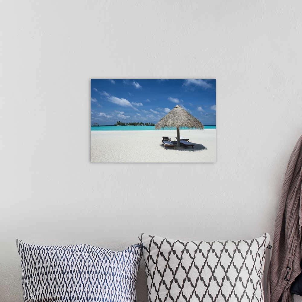 A bohemian room featuring Parasol on a white sand beach and turquoise water, Sun Island Resort, Nalaguraidhoo island, Ari a...