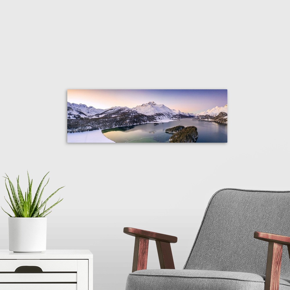 A modern room featuring Aerial panoramic of Piz Da La Margna and Lake Sils during a winter sunrise, Engadine, canton of G...
