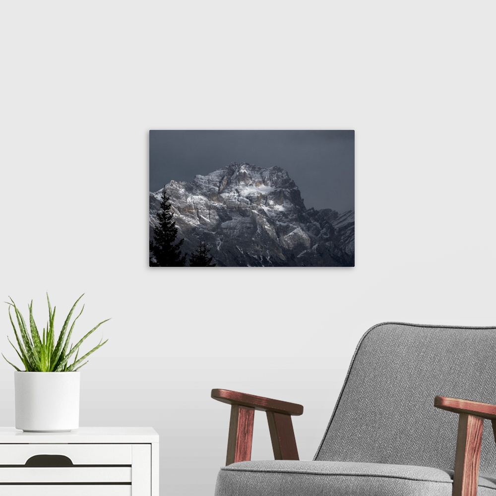 A modern room featuring Pomagagnon mountain covered by pristine snow on a cloudy day, Dolomites, Belluno, Veneto, Italy, ...