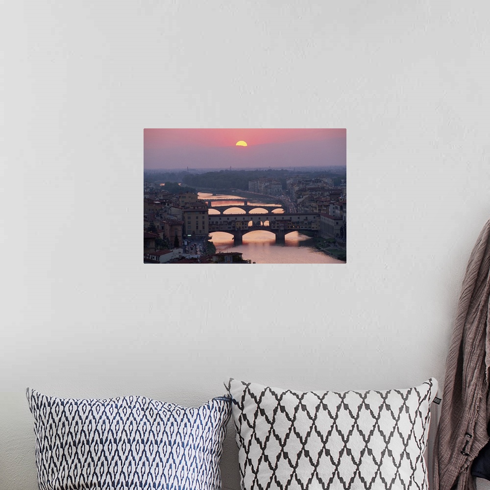 A bohemian room featuring Ponte Vecchio over the River Arno at sunset in the city of Florence, Tuscany, Italy