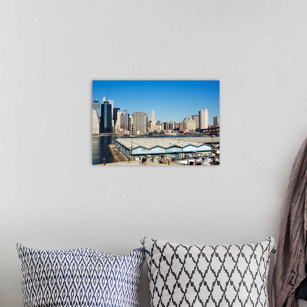 A bohemian room featuring Port Authority buildings on the Brooklyn side of the East River, NYC
