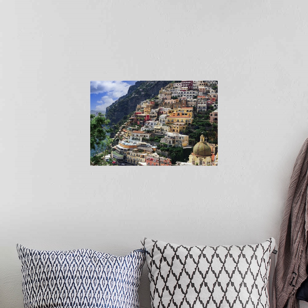 A bohemian room featuring Positano town hill view with low rise colorful buildings above the sea line, Positano, Amalfi Coa...