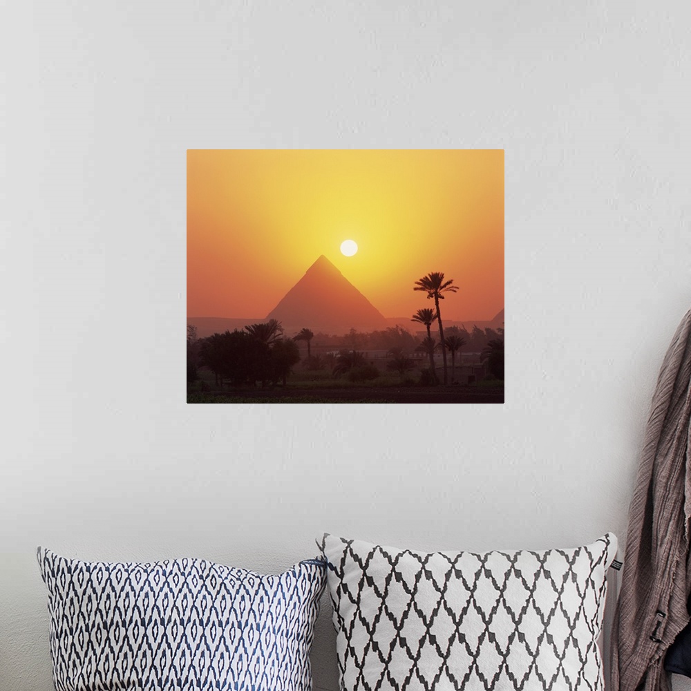 A bohemian room featuring Pyramid silhouetted at sunset, Giza, Cairo, Egypt, Africa