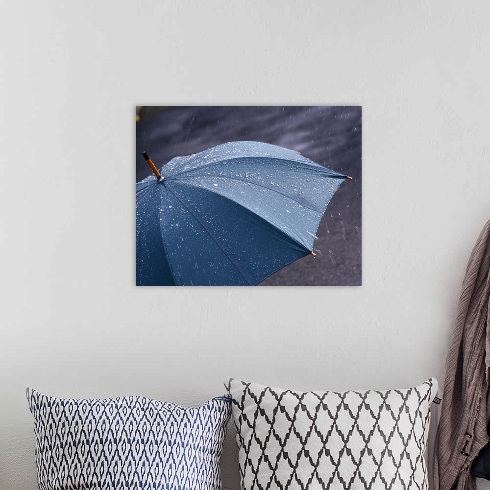 A bohemian room featuring Rain falling on an umbrella