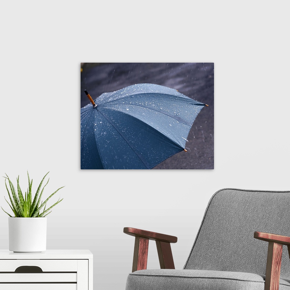 A modern room featuring Rain falling on an umbrella