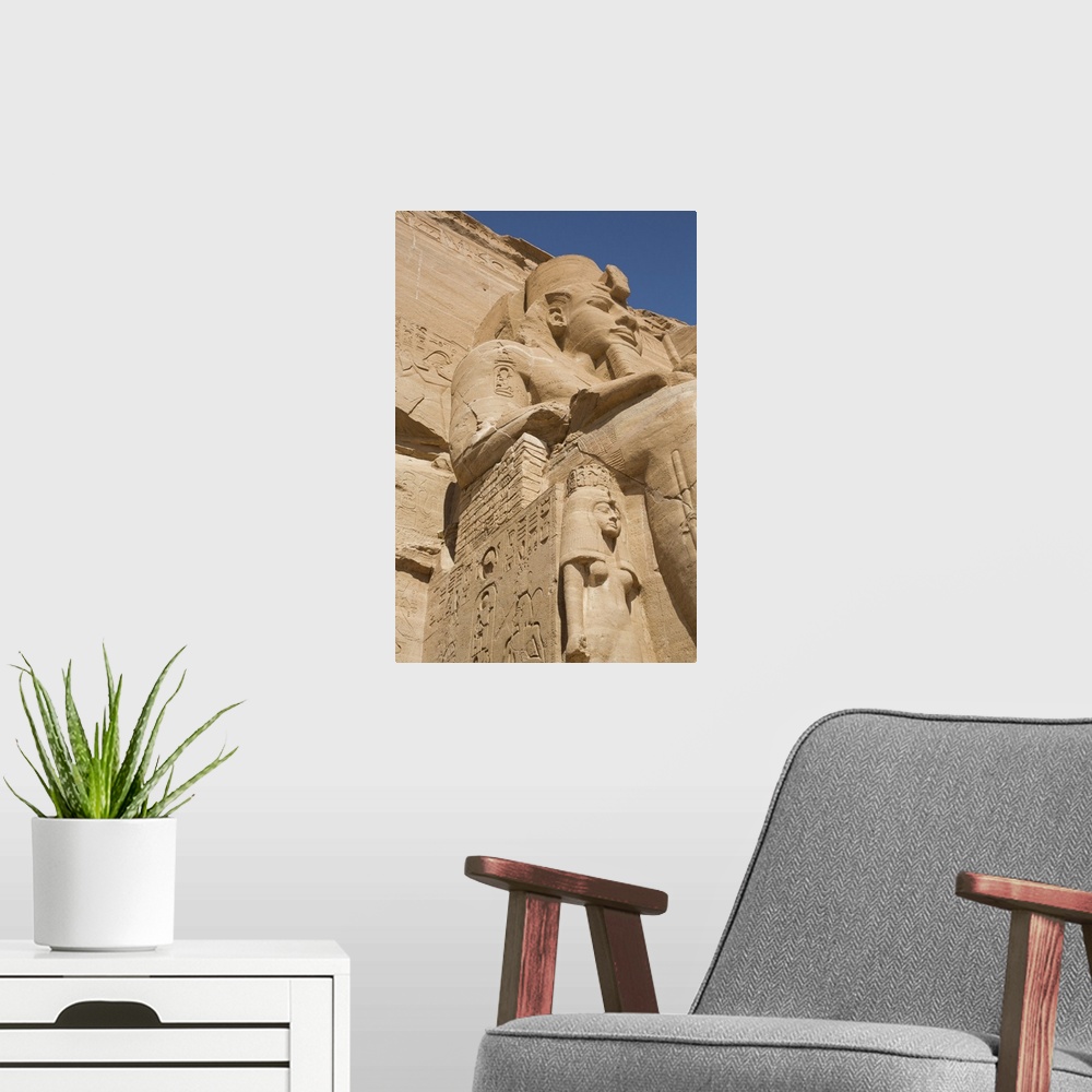 A modern room featuring Ramses II statue with Queen Nefertari statue at lower left, Ramses II Temple, UNESCO World Herita...