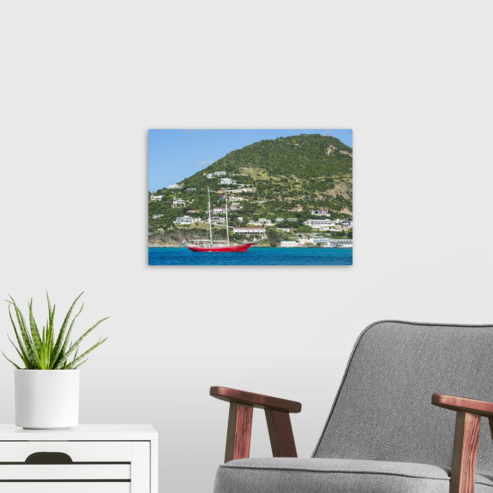A modern room featuring Red sailing boat in the bay of Philipsburg, Sint Maarten, West Indies, Caribbean