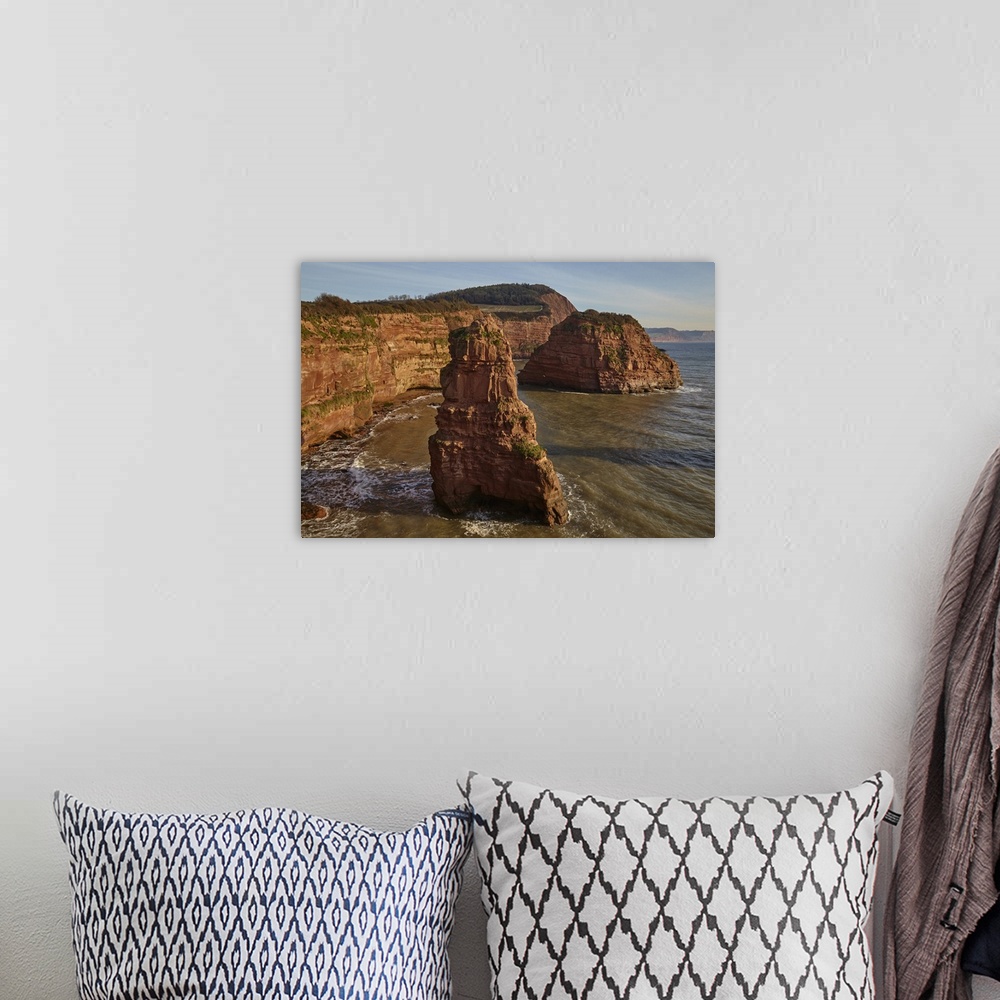 A bohemian room featuring Red sandstone cliffs and rocks at Ladram Bay, in the Jurassic Coast UNESCO World Heritage Site, n...