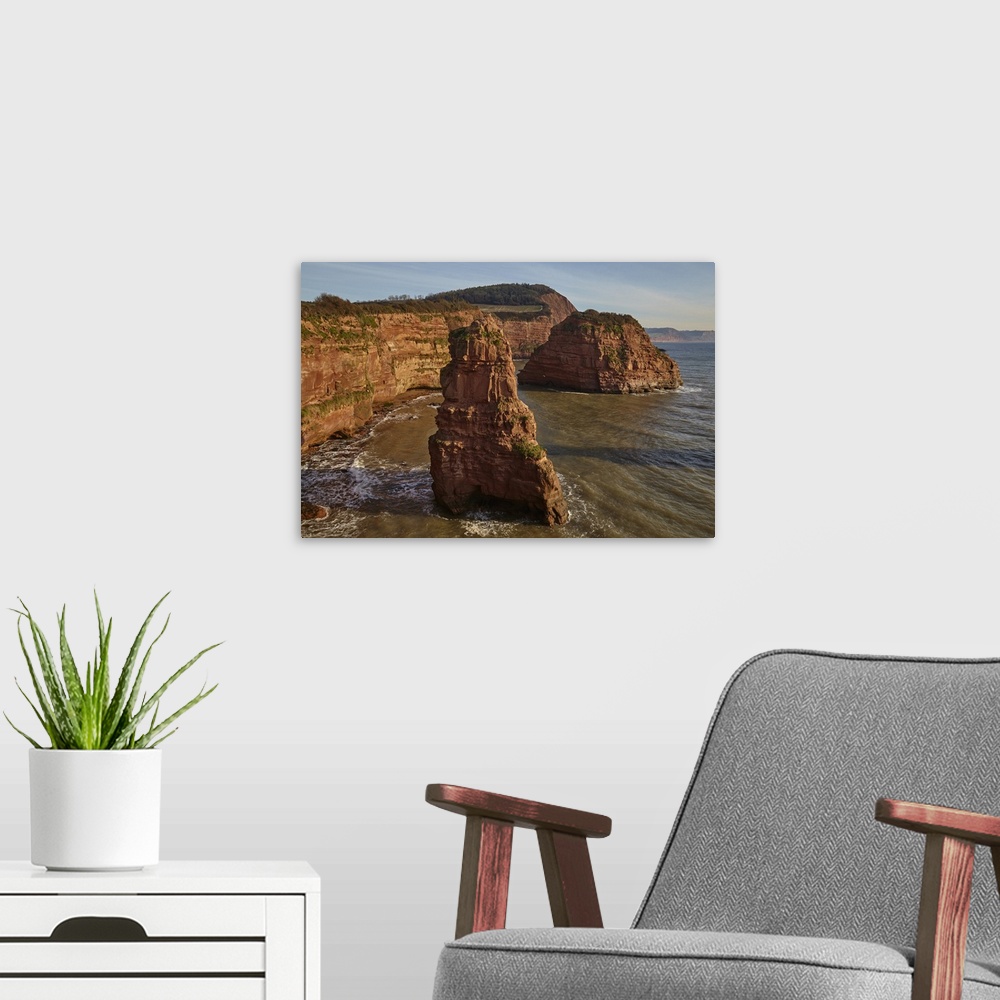 A modern room featuring Red sandstone cliffs and rocks at Ladram Bay, in the Jurassic Coast UNESCO World Heritage Site, n...