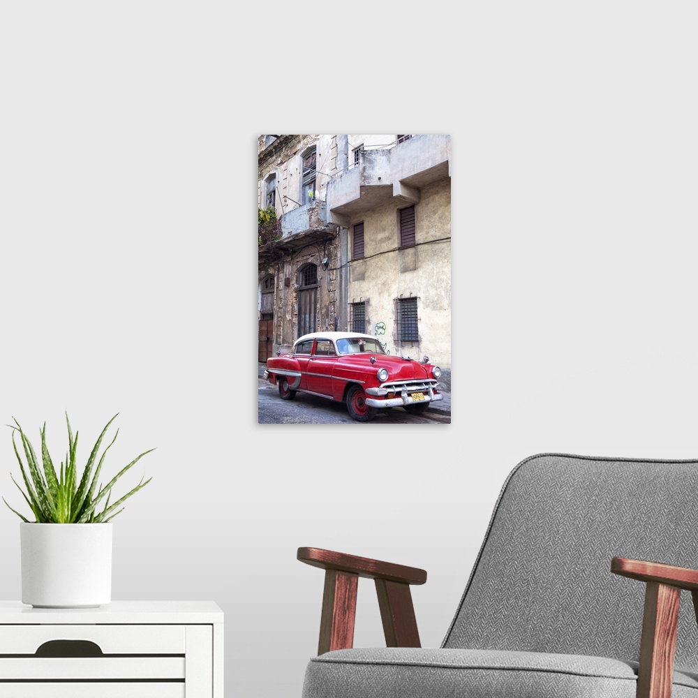 A modern room featuring Red vintage American car parked on a street in Havana Centro, Havana, Cuba