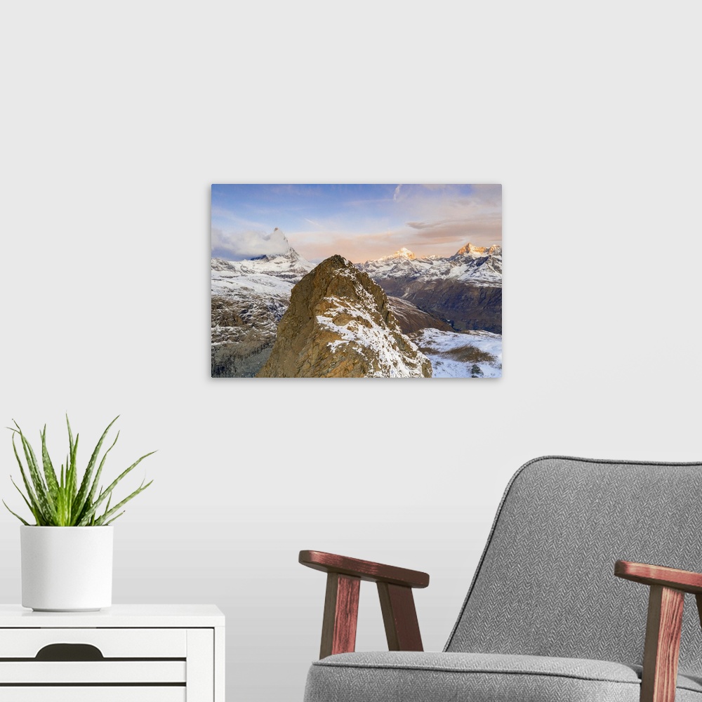 A modern room featuring Aerial view of Riffelhorn ridge, Matterhorn and Dent Blanche at sunrise, Zermatt, canton of Valai...