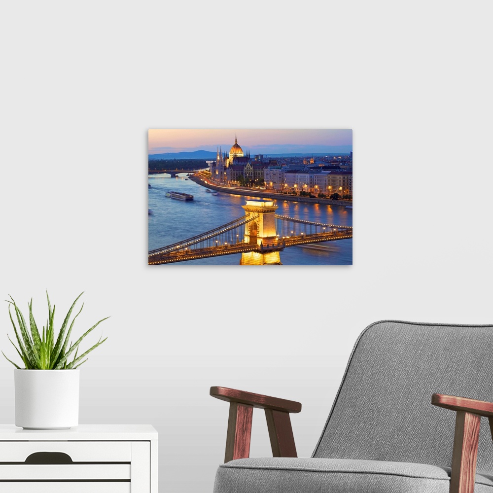 A modern room featuring River Danube and Hungarian Parliament at dusk, Budapest, Hungary