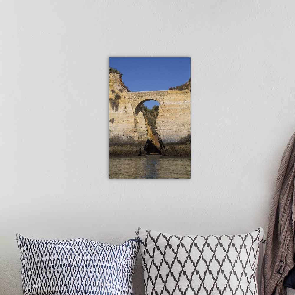 A bohemian room featuring Roman Bridge, near Lagos, Algarve, Portugal, Europe