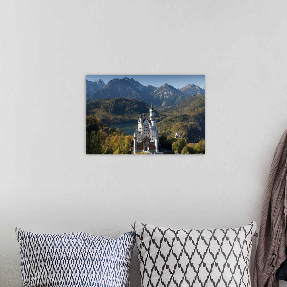 A bohemian room featuring Romantic Neuschwanstein Castle and German Alps in autumn, Bavaria, Germany