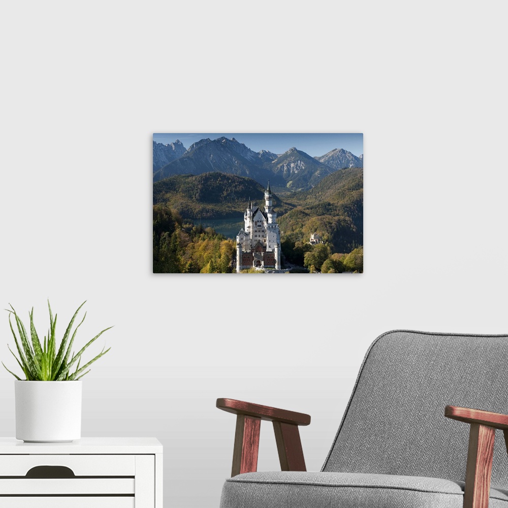 A modern room featuring Romantic Neuschwanstein Castle and German Alps in autumn, Bavaria, Germany