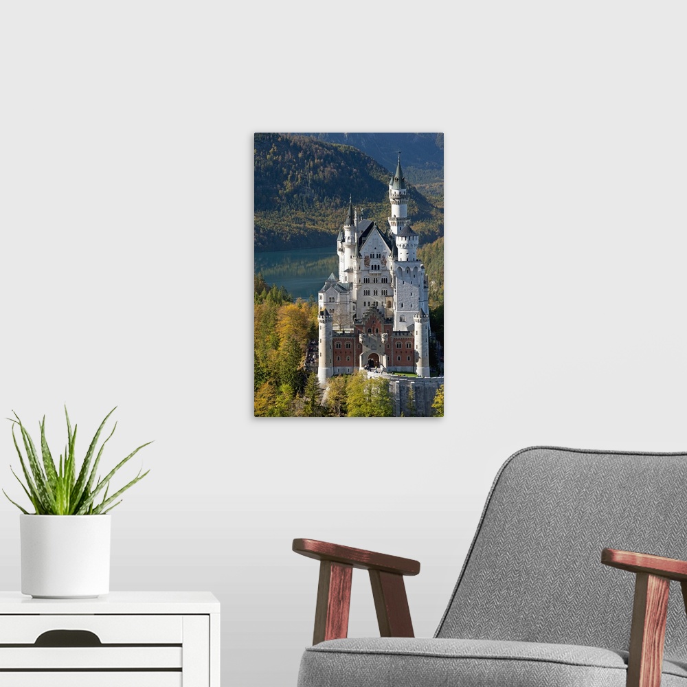 A modern room featuring Romantic Neuschwanstein Castle and German Alps in autumn, Bavaria, Germany