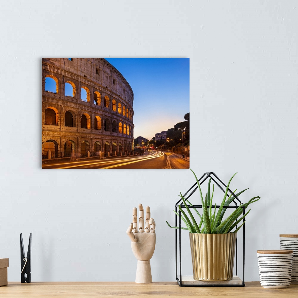 A bohemian room featuring Rome Colosseum (Flavian Amphitheatre) at night with light trail, UNESCO World Heritage Site, Rome...