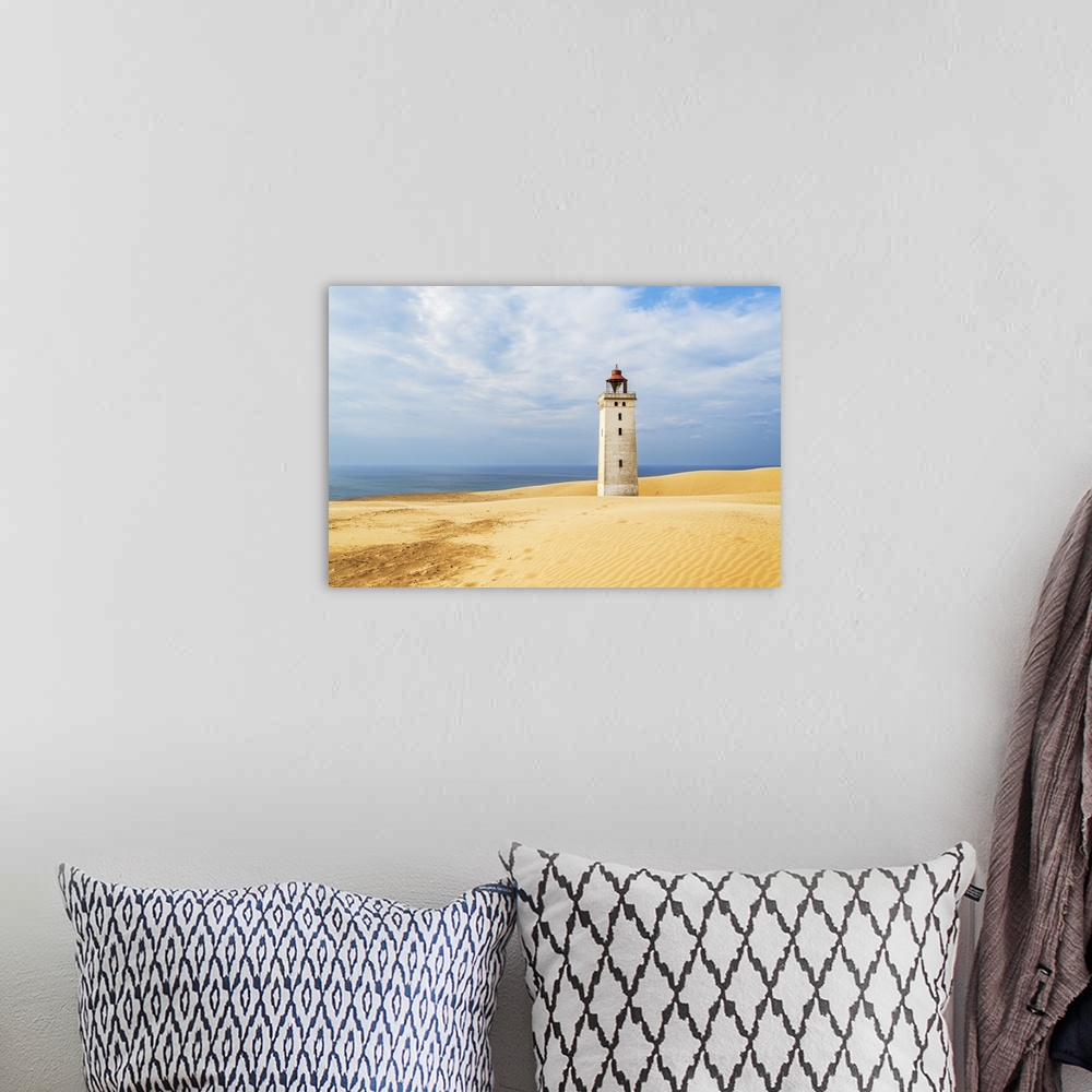 A bohemian room featuring Rubjerg Knude lighthouse surrounded by sand dunes, Jutland, Denmark, Europe