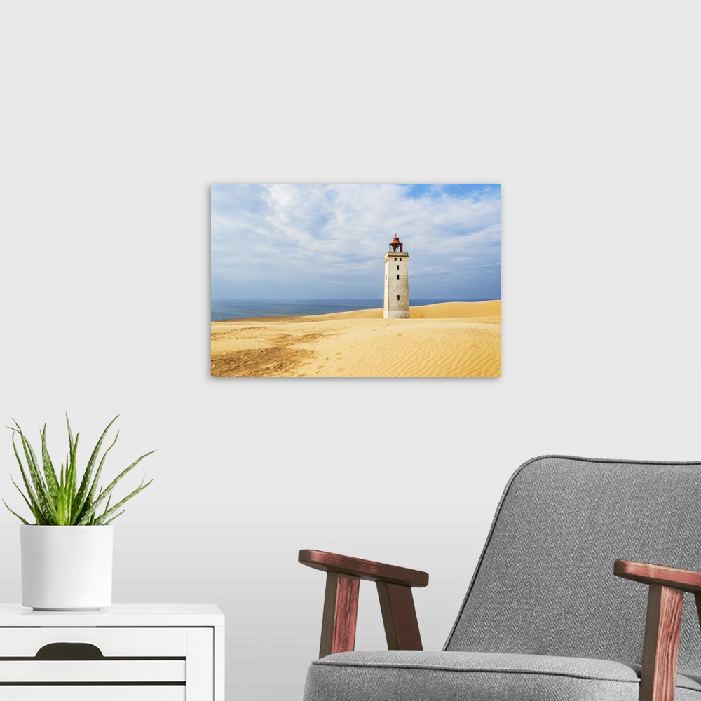 A modern room featuring Rubjerg Knude lighthouse surrounded by sand dunes, Jutland, Denmark, Europe